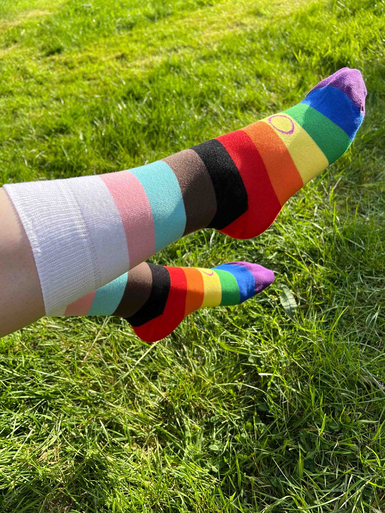 Unisex adults Progress Pride Socks. These Progressive Striped Flag socks have been created with love to support your feet and your “sole”. To assist your true authentic self when you’re walking with purpose, pride, and style. Our range of Genderqueer Pride Socks aim to make the world a brighter and more loving place. 